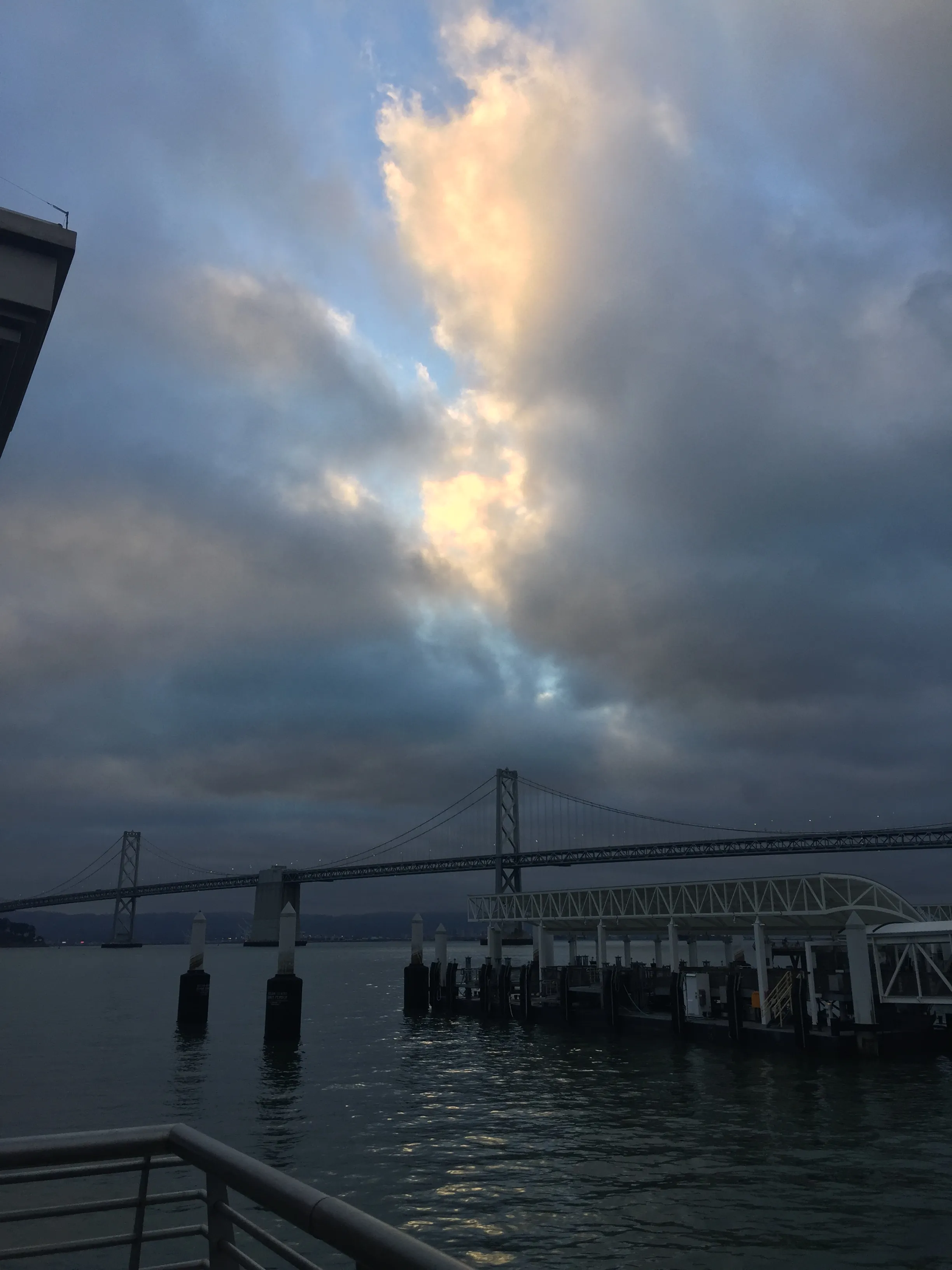 Here's the cloudy sunrise! That's Oakland-Bay Bridge in the
pic.